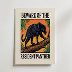 Resident Panther affisch med svart panter på gren i orange solnedgång, tryckt i Sverige